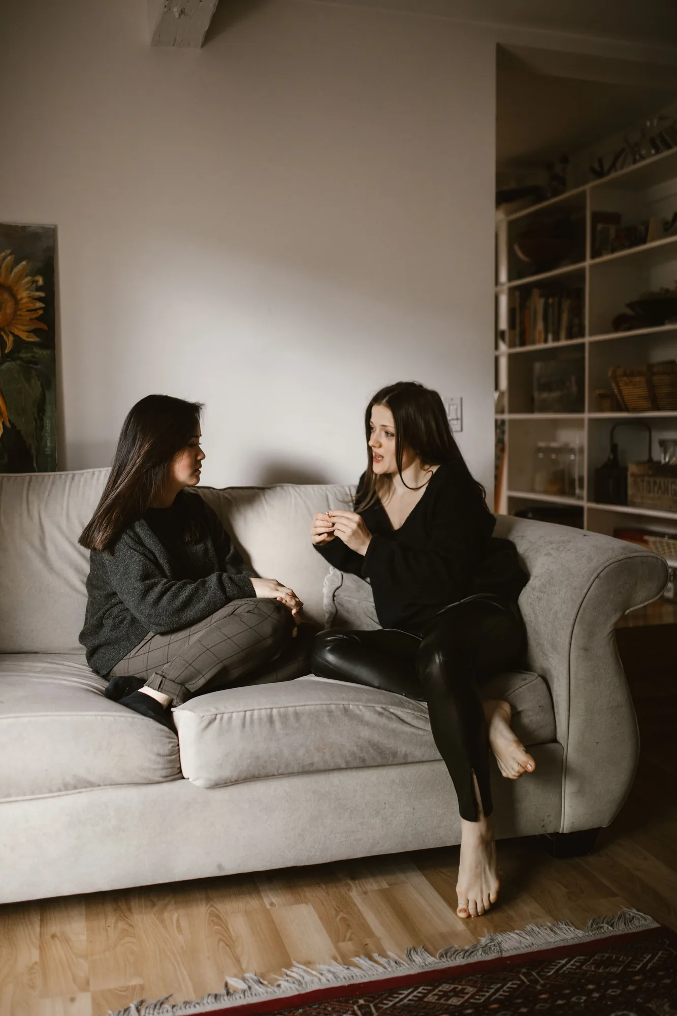 Two women talking together in a relaxed setting